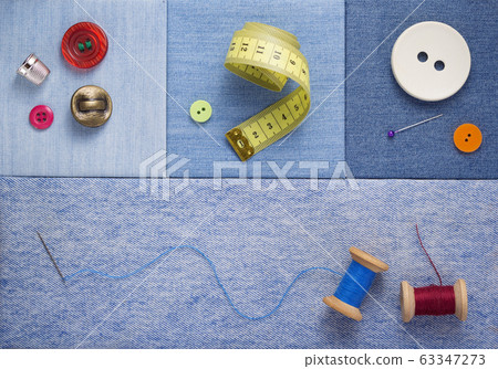sewing tools and accessories on jeans background sewing tools and accessories on jeans background 63347273