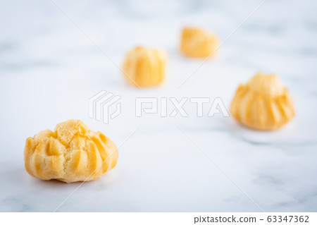 Delicious eclair vanilla cream, choux dough filled with a cream, homemade bakery 63347362