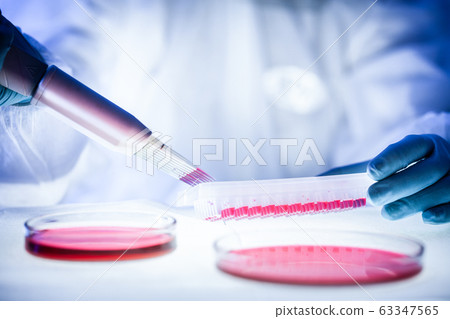 Nurse holding test tube with blood for 2019-nCoV analyzing. Novel Chinese Coronavirus blood test Concept. 63347565