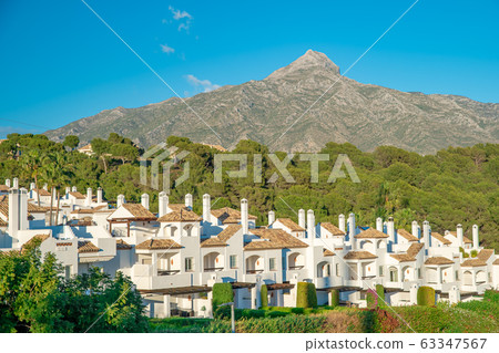 White houses in Spain under the mountain La Concha 63347567