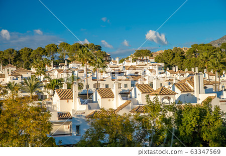 panorama overlooking the white houses in the south of spain. Holiday homes near the seashore panorama overlooking the white houses in the south of spain. Holiday homes near the seashore 63347569