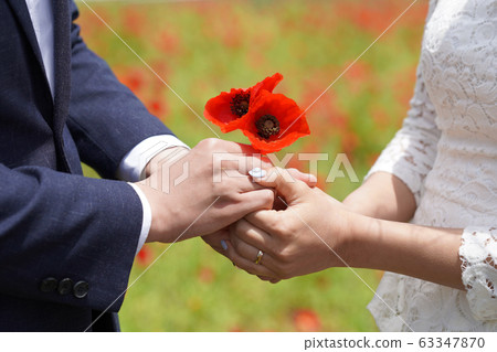 A loving couple holding hands A loving couple holding hands 63347870