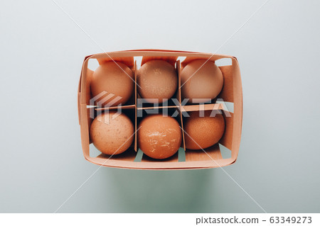 Farm organic eggs in wooden basket Farm organic eggs in wooden basket 63349273