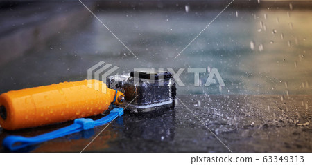 Action camera in waterproof case and floater grip Action camera in waterproof case and floater grip 63349313