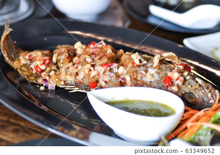 fried fish with vegetable, fried nile tilapia fried fish with vegetable, fried nile tilapia 63349652