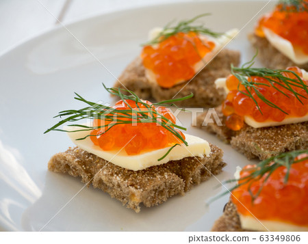 Canapes with red caviar and butter closeup Canapes with red caviar and butter closeup 63349806