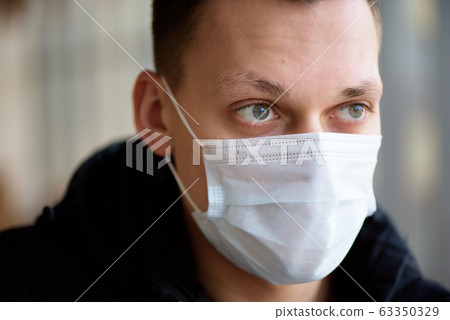Man and woman wearing protective mask against transmissible infectious diseases Man and woman wearing protective mask against transmissible infectious diseases 63350329