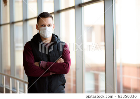 Man and woman wearing protective mask against transmissible infectious diseases Man and woman wearing protective mask against transmissible infectious diseases 63350330