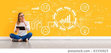 Marketing concept with woman using a tablet 63350925