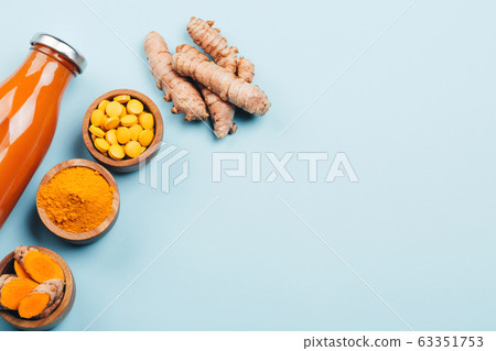 Turmeric in different conditions: fresh, dry root, pills, powder and cut plant. Turmeric in different conditions: fresh, dry root, pills, powder and cut plant. 63351753