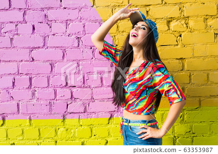 Street dance, freestyle and jazz funk concept - Beautiful girl hip-hop dancer over brick wall with copy space. 63353987