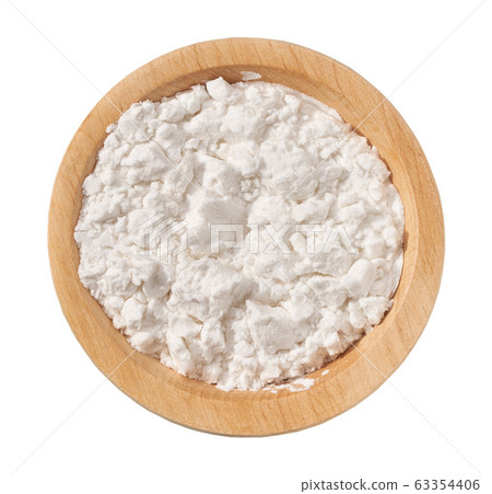 Wooden plate with potato starch isolated on a Wooden plate with potato starch isolated on a 63354406