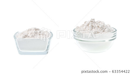 Glass plate with potato starch isolated on a white 63354422