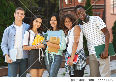 Group portrait of multicultural college students posing in campus 63354489