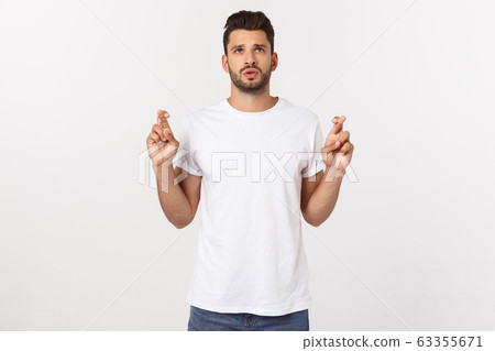 Close up portrait of disappointed stressed bearded young man in shirt over white background. 63355671