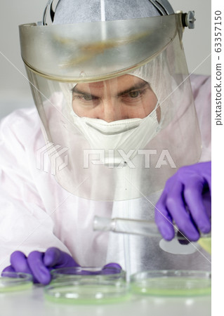 Scientist working in corona virus vaccine development laboratory research facility. 63357150