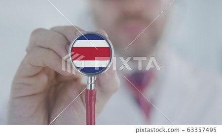 Physician listening with the stethoscope with flag of Costa Rica. Costa Rican healthcare Physician listening with the stethoscope with flag of Costa Rica. Costa Rican healthcare 63357495