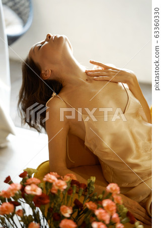 Sensual woman in her bedroom on sunset Sensual woman in her bedroom on sunset 63360330