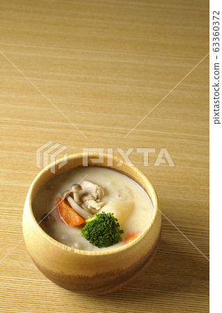 Cream stew in a wooden bowl Cream stew in a wooden bowl 63360372