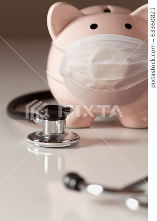 Piggy Bank Wearing Medical Face Mask and Stethoscope 63360821