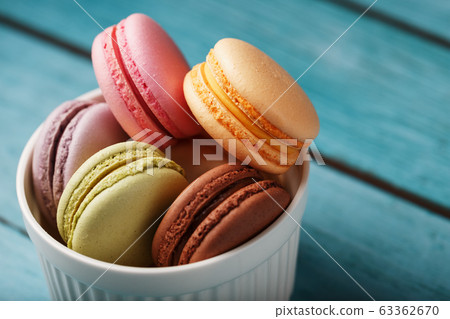 Macaroni cookies are placed in a white plate on a 63362670