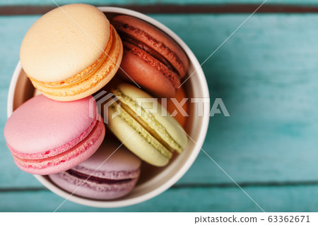 Macaroni cookies are placed in a white plate on a 63362671