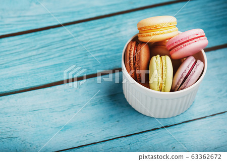 Macaroni cookies are placed in a white plate on a 63362672