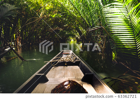 Travel on a wooden boat in the floating market. Travel on a wooden boat in the floating market. 63362721