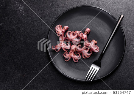 Black seafood pasta with shrimp and octopus 63364747