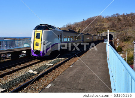 Shooting the scenery of the limited express Hokuto passing through JR Sakimori Station in Muroran City, Hokkaido in early spring Shooting the scenery of the limited express Hokuto passing through JR Sakimori Station in Muroran City, Hokkaido in early spring 63365156