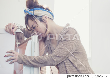 Woman in room wear Woman in room wear 63365237