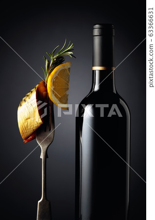Bottle of wine and smoked mackerel with lemon Bottle of wine and smoked mackerel with lemon 63366631