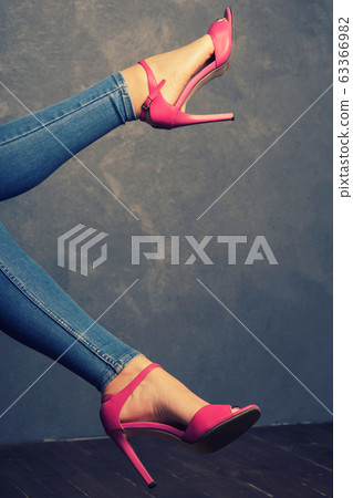 Women's legs in pink sandals with high heels in Women's legs in pink sandals with high heels in 63366982