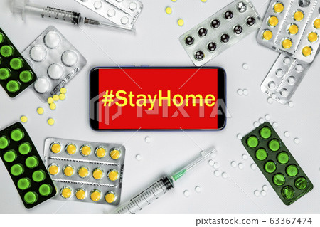 Smartphone with pills and vaccine. Coronavirus 2019-nCoV. Stay at home. Quarantine. 63367474
