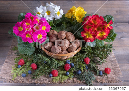 walnuts with flowers and berries 63367967
