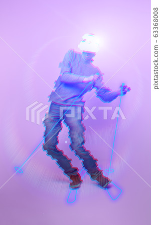 Man skiing at mountain using virtual reality headset. Image with glitch effect. Man skiing at mountain using virtual reality headset. Image with glitch effect. 63368008