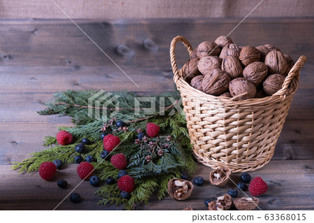 walnuts in a basket and berries 63368015