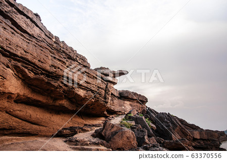 Large Sand stone canyon cliff shoreline of Mekong river 63370556