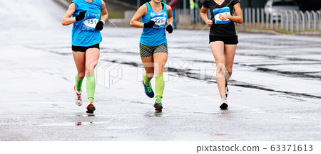 three female athletes runners run 63371613