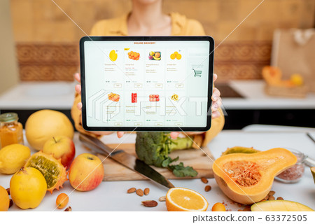 Woman shopping online using digital tablet Woman shopping online using digital tablet 63372505