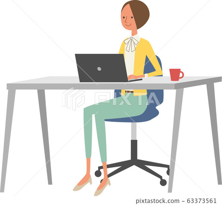Woman A using computer at desk A Woman A using computer at desk A 63373561