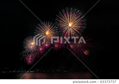 Colorful fireworks of various colors at night with celebration and anniversary concept 63373737