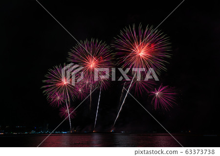 Colorful fireworks of various colors at night with celebration and anniversary concept 63373738