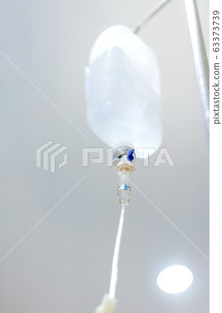 Normal saline solution or sodium chloride with infusion bottle drip for patient in hospital. 63373739