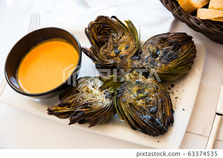 Chargrilled artichokes with romesco 63374535