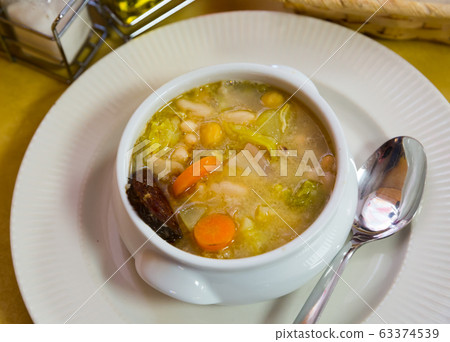 Bean's catalan soup with carrots and potatoes, served with black sausage Bean's catalan soup with carrots and potatoes, served with black sausage 63374539