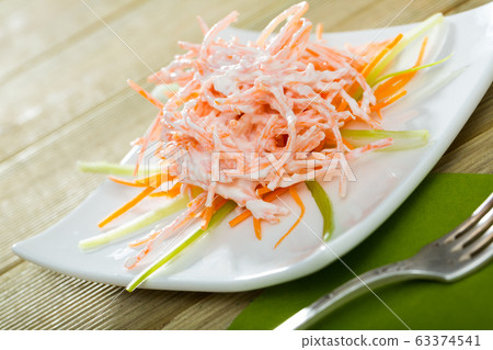 Vegetables dish, salad with carrots, garlic and greek yogurt served at plate Vegetables dish, salad with carrots, garlic and greek yogurt served at plate 63374541