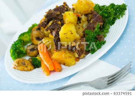 Stewed with beef with vegetables Stewed with beef with vegetables 63374591