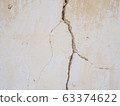 Cement concrete wall was cracked, beige color paint peel.  63374622