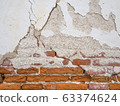 Cement concrete wall was cracked, beige color paint peel.  63374624